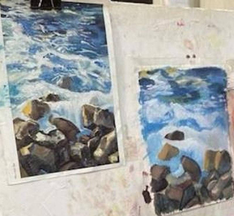 Acuarela de unas rocas y olas del mar pintada en la academia